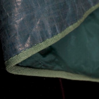 The bottom edge of the skirt is finished with braid to protect from abrasion. This image shows the skirt turned inside out.
