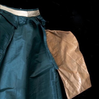 The single pocket in the skirt is made from polished cotton, although this fabric is not as heavily waxed and stiff as the lining at the hem.