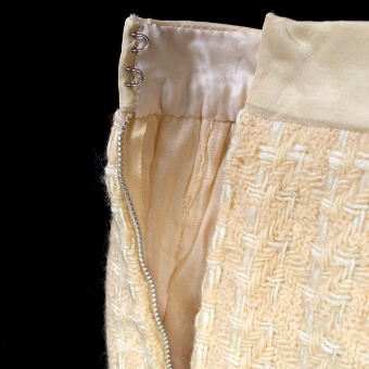 The waistband of the skirt is a crisp silk that is laid on the bias to ensure it remains neat and flat.